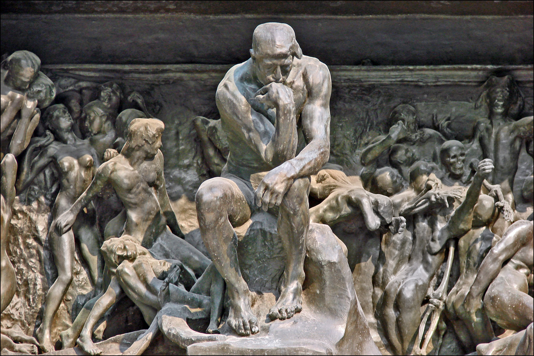 The Thinker surrounded by figures from Rodin's Gates of Hell